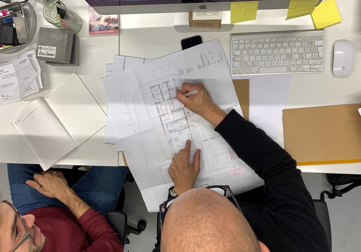 professional working on technical drawing